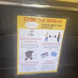 COVID sign. Phenomenally done and if you're a caribbean human, it gives you quite a chuckle