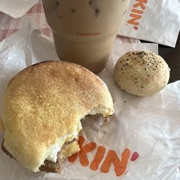 a half eaten sandwich and a drink a half eaten sandwich and a drink