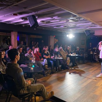 Last Best Comedy - a man standing on stage in front of a crowd - Arts & Entertainment Near Me - Bozeman, Montana