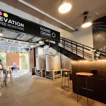 Elevation Coffee Roasters - a man working on a laptop - Coffee Roasteries Near Me - Tampa Bay, Florida