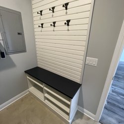 Innovative Spaces - Laundry room peg board and bench with shoe shelves underneath