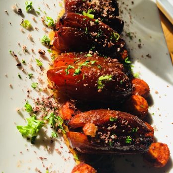 Oliver's Twist - Blue Cheese - bacon Stuffed Dates , Warm Tomato Vinaigrette , Marcona Almonds - New American Near Me - Seattle, Washington Oliver's Twist - Blue Cheese - bacon Stuffed Dates , Warm Tomato Vinaigrette , Marcona Almonds - New American Near Me - Seattle, Washington