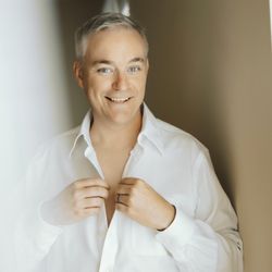 Amor Boudoir - I liked how Tyler highlighted my smile and used the white curtains to help frame the shot.