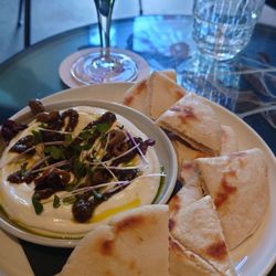 Bar Kantoor - Labneh spread, pistachio dressing, olives and pita.