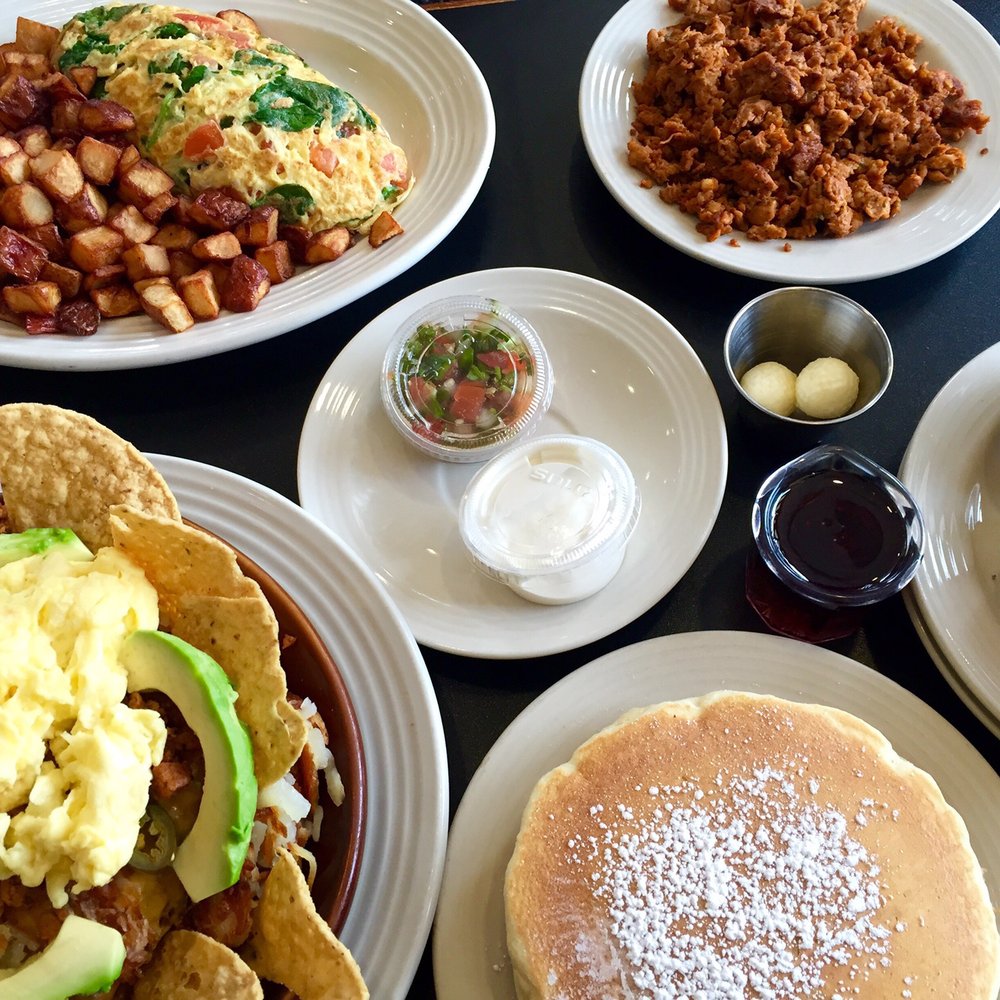 Stacked - Greek omelet with a side of chicken chorizo and toast on top. Olé skillet with chicken chorizo and pancakes on bottom. - Breakfast & Brunch Near Me - Oak Lawn, Illinois Stacked - Greek omelet with a side of chicken chorizo and toast on top. Olé skillet with chicken chorizo and pancakes on bottom. - Breakfast & Brunch Near Me - Oak Lawn, Illinois