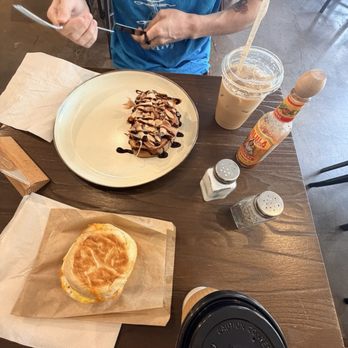 Old World Coffee Roasters - Prosciutto Toast, sausage and egg sandwich, iced vanilla latte - Coffee & Tea Near Me - Reno, Nevada Old World Coffee Roasters - Prosciutto Toast, sausage and egg sandwich, iced vanilla latte - Coffee & Tea Near Me - Reno, Nevada