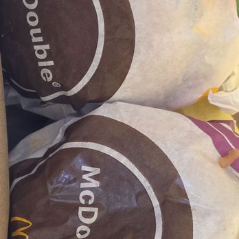 McDonald's - Inside bag view of two double cheeseburgers and two McChickens, easy cheap goto for on the road go food. - Coffee & Tea Near Me - Magee, Mississippi