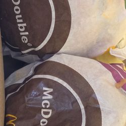 McDonald's - Inside bag view of two double cheeseburgers and two McChickens, easy cheap goto for on the road go food.
