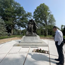 Historic Winter Quarters Visitors Center - Some of the graves around the statue are left uncovered by the cement walkway.