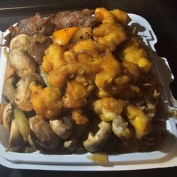 Asian Gourmet Wok & Grill - Black pepper beef, orange chicken, and mushrooms on half chow mein and half fried rice