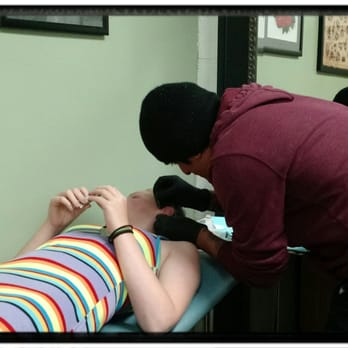 Get My Point - Ivan piercing Erin's ear - Piercing Near Me - Laguna Hills, California