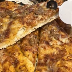 Me-n-Ed's Pizzeria - Not much cheese , hard and cold as delivered . Second time in a row