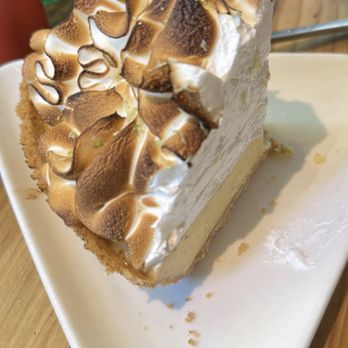 Moondog Cafe & Bakery - The delicious key lime pie standing tall , at whopping 3 dollops of whip cream - Cafes Near Me - Key West, Florida Moondog Cafe & Bakery - The delicious key lime pie standing tall , at whopping 3 dollops of whip cream - Cafes Near Me - Key West, Florida