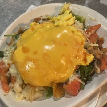 Maxfields Pancake House - Veggie Skillet - A breakfast dish featuring a fried egg with a runny yolk on top of vegetables, cheese, and other ingredients. - Breakfast & Brunch Near Me - Schaumburg, Illinois
