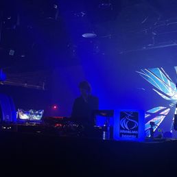 two djs on stage at a concert two djs on stage at a concert