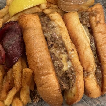 CleaveLand Grill - Strongsville - Ribeye Philly Cheesesteak with in-house sauce on side, fries, and really great beef bacon - Burgers Near Me - Strongsville, Ohio CleaveLand Grill - Strongsville - Ribeye Philly Cheesesteak with in-house sauce on side, fries, and really great beef bacon - Burgers Near Me - Strongsville, Ohio
