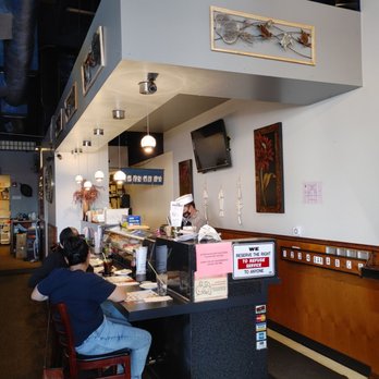 Fuji's Grill & Sushi - a man sitting at the counter - Japanese Near Me - Vancouver, Washington Fuji's Grill & Sushi - a man sitting at the counter - Japanese Near Me - Vancouver, Washington