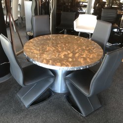 Living Modes - Custom Silver Brushed Steel Dining Set. 48" round.