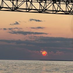 Ugly Anne Boat Tours - Sunset with Mackinac bridge.