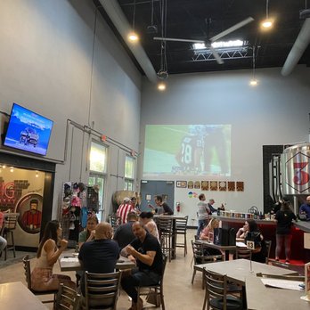 3 Sons Brewing - Interior of the bar with big screen projection - Breweries Near Me - Dania Beach, Florida