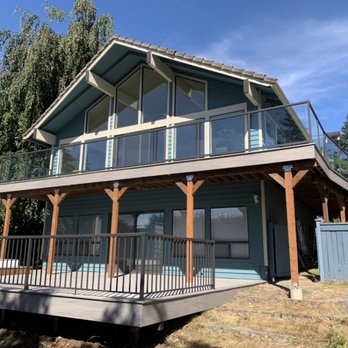 Euro Deck and Fence - Wolf Decking SilverTeak Color + Glass Railing Gun Metal Color on Top/Bottom/Posts - Decks & Railing Near Me - Maple Valley, Washington Euro Deck and Fence - Wolf Decking SilverTeak Color + Glass Railing Gun Metal Color on Top/Bottom/Posts - Decks & Railing Near Me - Maple Valley, Washington