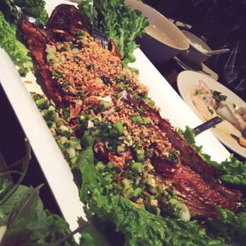 Saigon Block - The baked catfish! It was garnished with green onions, peanuts and lettuce. - Vietnamese Near Me - Richardson, Texas