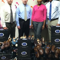 We Treat Feet Podiatry - The docs at WeTreatFeet pose with donated shoes for the homeless