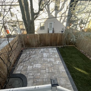 Alpha Electrical Services - You can't really see it but there's two little electrical boxes - one in the grass and one fixed in the patio. - Electricians Near Me - Weehawken, New Jersey