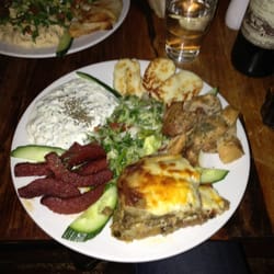 Empires - Mixed mere platter - moussaka, Turkish sausage, halloumi, spiced chicken, yoghurt'mint'garlic sauce, mixed salad and pitta bread