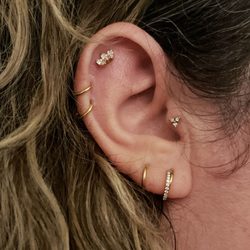 Curated Piercing Studio - Piercings By Jenn - Tragus, double helix, and flat piercings.