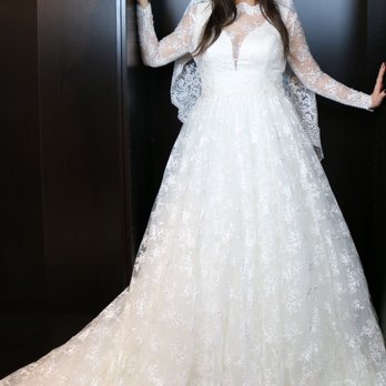 Asterino Sposa - ."Keeley" lace jacket over an ivory aline wedding gown, with detachable extended "Keeley" lace skirt and train. - Bridal Near Me - Reading, Ohio