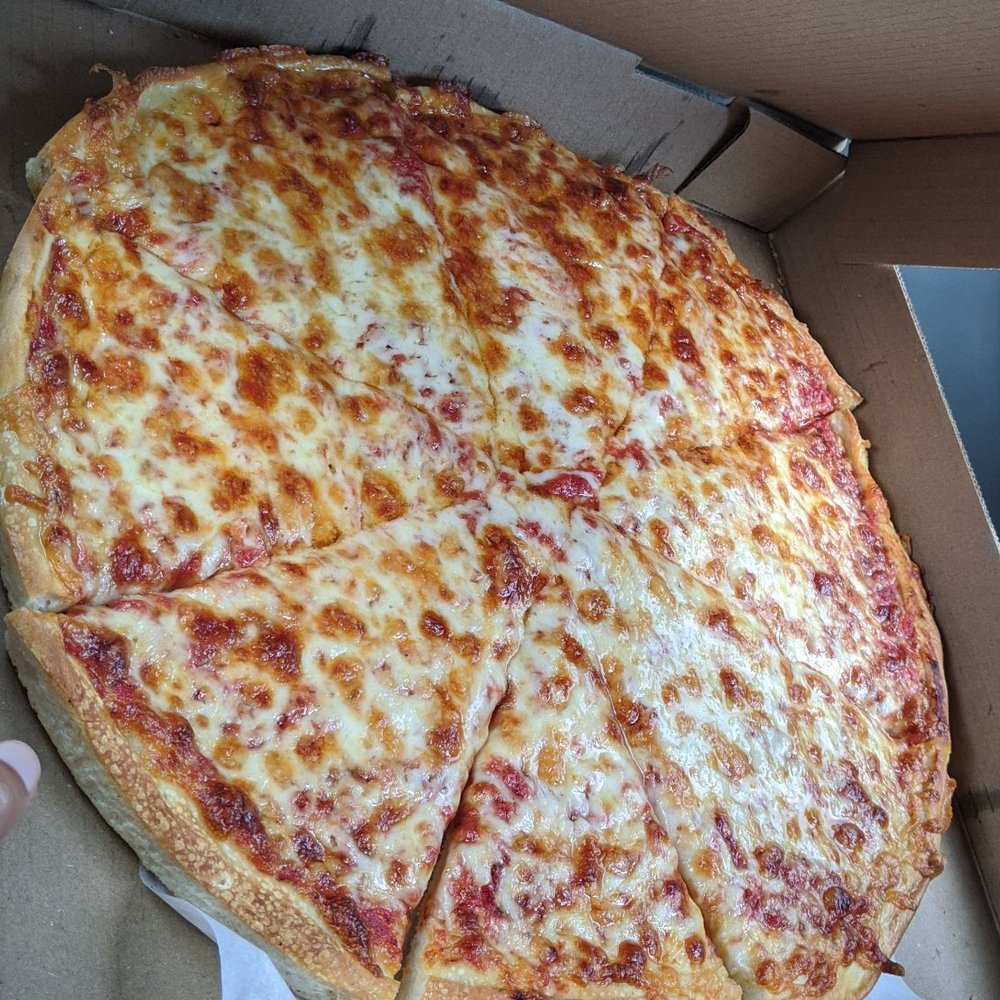 Fresh hot cheese pizza right out the oven. Delicious. Fresh hot cheese pizza right out the oven. Delicious.