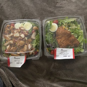 Chick-fil-A - Cobb Salads 1 with nuggets cut up and ready too consume. The other with a whole breast on it. Why is that not ready too eat?? - Fast Food Near Me - Pittsburg, California