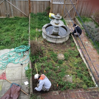 Ricky's Landscaping and Gardening Services - a man working on a garden - Gardeners Near Me