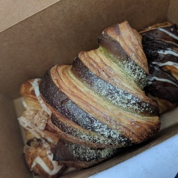 Chocorrant Patisserie & Cafe - Left: cinnamon swirl crossiant Middle: matcha crossiant Right: cookies and cream crossiant - Desserts Near Me - Edmonton, Alberta Chocorrant Patisserie & Cafe - Left: cinnamon swirl crossiant Middle: matcha crossiant Right: cookies and cream crossiant - Desserts Near Me - Edmonton, Alberta
