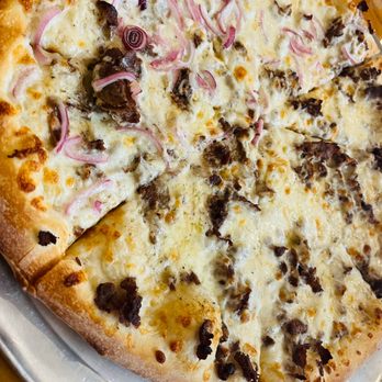 Stone L'oven Pizza Co - a sliced pizza on a plate - Pizza Near Me - Canton, Massachusetts Stone L'oven Pizza Co - a sliced pizza on a plate - Pizza Near Me - Canton, Massachusetts