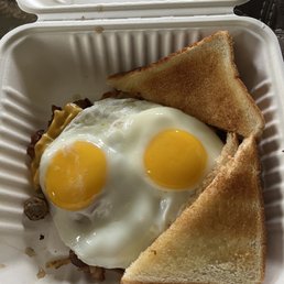 Perfectly cooked sun side up eggs,  Meat Lover's Skillet
