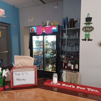 Bear-n-T’s Hideaway - ows a bar with a sign on the counter - Burgers Near Me - Alexandria, Nebraska