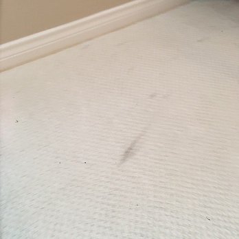 Sun State Window Cleaning - Not a great picture, but you can see dirt streaks on the carpet and clumps of dirt. This was ALL over the house. - Window Washing Near Me