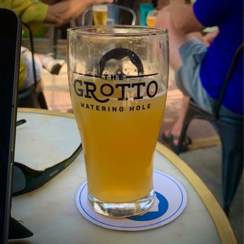 The Grotto - a glass of beer on a table - Pubs Near Me - Ann Arbor, Michigan The Grotto - a glass of beer on a table - Pubs Near Me - Ann Arbor, Michigan