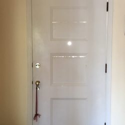 Fast Train Property Management - Front Door of the home we leased & took VERY GOOD CARE OF. It needed to obviously be sealed a bit.