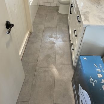 Mason’s Renovation - a bathroom with a toilet and sink - Flooring Near Me Mason’s Renovation - a bathroom with a toilet and sink - Flooring Near Me