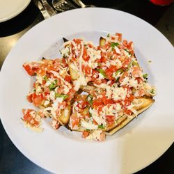 Reale's Italian Cafe - Bruschetta WOW! They do not skimp on the portions! Very Italian American style.