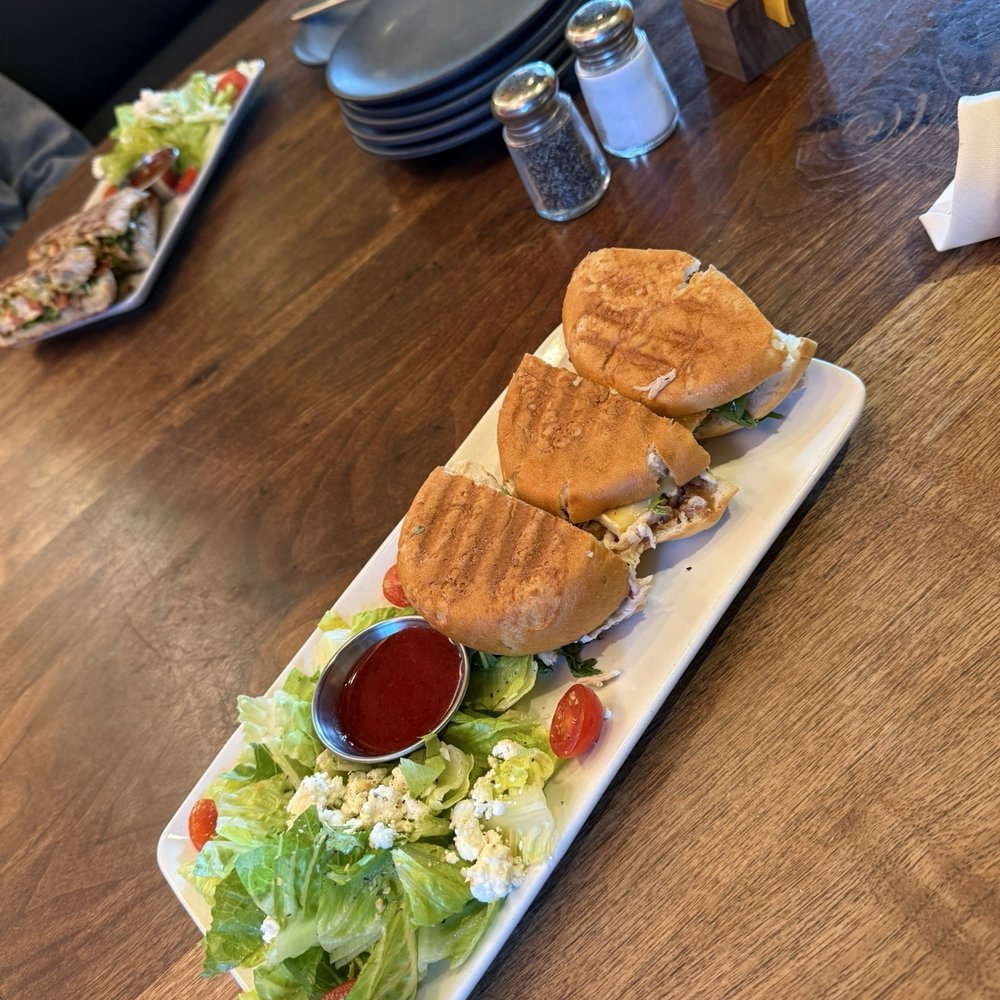 Postino Uptown Park - Gluten free Prosciutto Brie Panini (sub chicken) - Wine Bars Near Me - Houston, Texas Postino Uptown Park - Gluten free Prosciutto Brie Panini (sub chicken) - Wine Bars Near Me - Houston, Texas