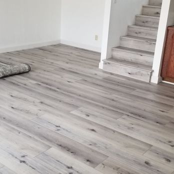 Infinite Flooring - Living room floor after with vinyl planks - Flooring Near Me