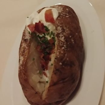 Anthony's Chophouse - Massive baked potato the size of a small rabbit, complete with a sour cream puff "tail", chives and bacon - Steakhouses Near Me - Sparks, Nevada Anthony's Chophouse - Massive baked potato the size of a small rabbit, complete with a sour cream puff "tail", chives and bacon - Steakhouses Near Me - Sparks, Nevada