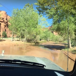 Twin Trails Tour - Crossing a river in the Chevy Silverado. Looks ok here but cracked windshield and fumes from leaky exhaust system.
