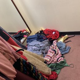 Full of dresses just left on the ground and not cleaned up for hours