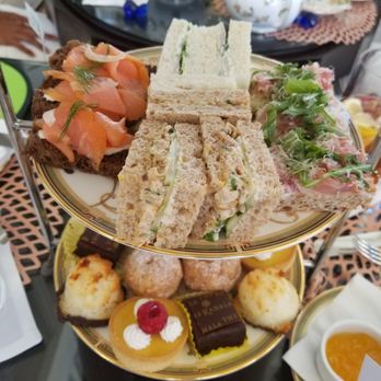 The Veranda - Middle tier = savory sandwiches (salmon, cucumber, prosciutto, and chicken) - Wine Bars Near Me - Honolulu, Hawaii