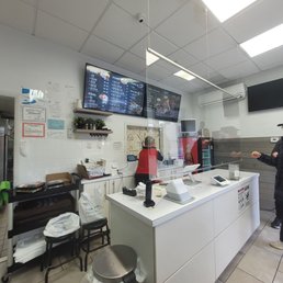 a man standing in a kitchen a man standing in a kitchen